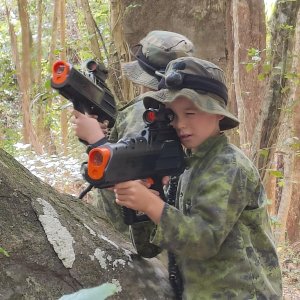 two kids playing laser tag with awesome cobras